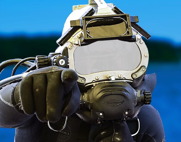 The KM 97 with water shroud installed and diver pointing to viewer.